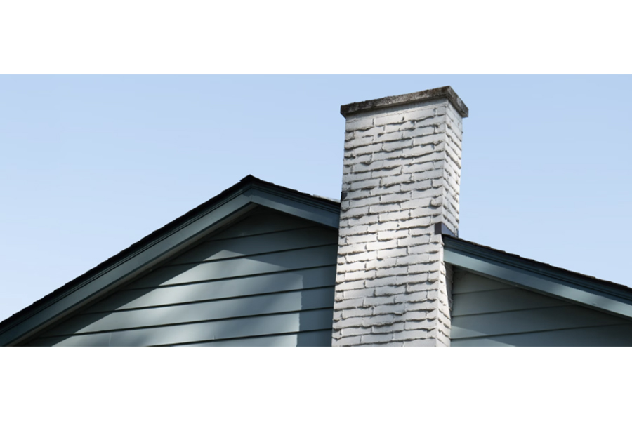 White painted masonry chimney