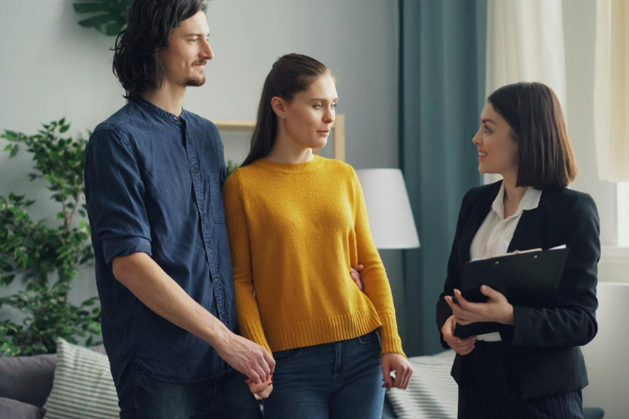 Real estate agent talking to clients
