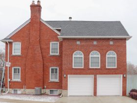 Masonry chimney in a brick house