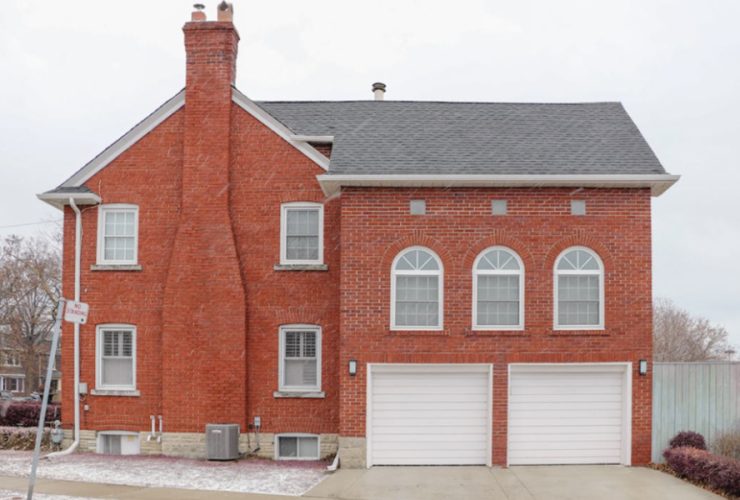 Masonry chimney in a brick house