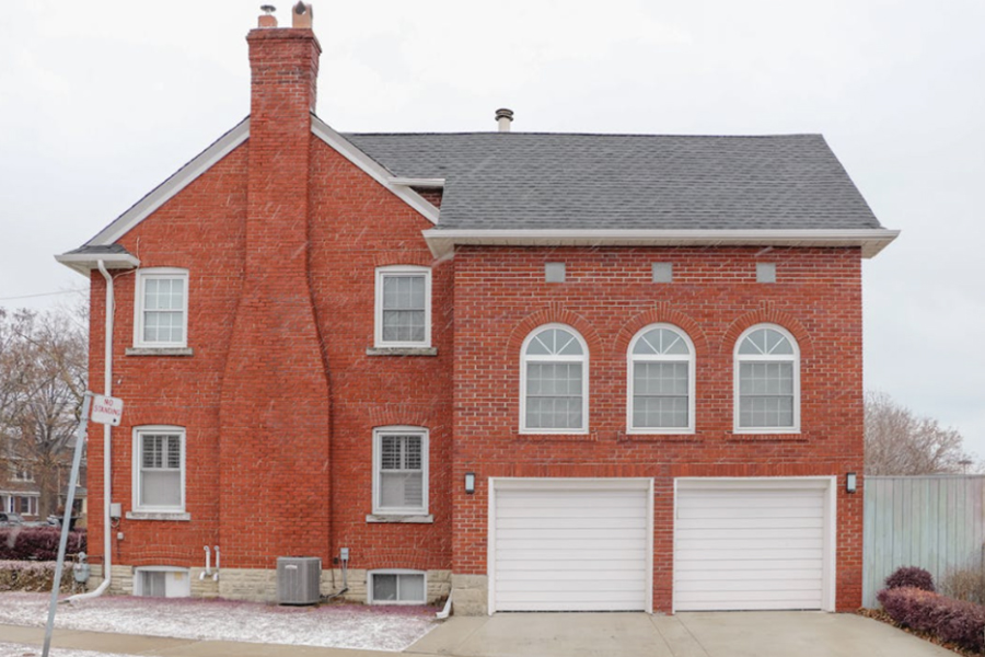 Masonry chimney in a brick house