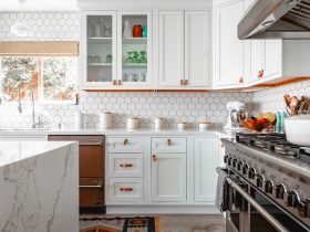 a kitchen with white cabinetry