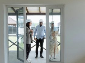 Real estate agent showing potential buyers a house